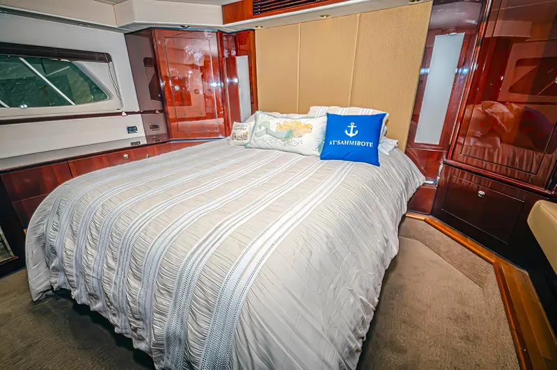 At's Ahmibote V Yacht Photos Pics Luxurious bedroom interior of 2011 Sea Ray 580 Sundancer yacht with elegant bedding.