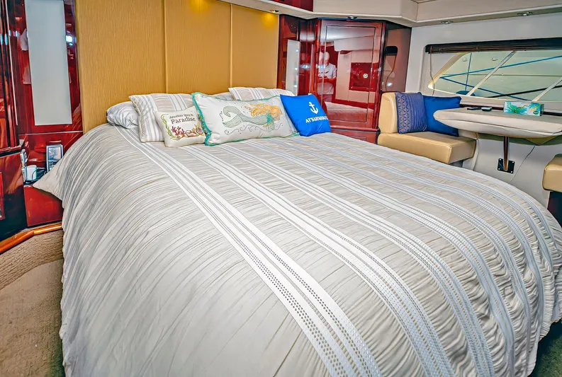 At's Ahmibote V Yacht Photos Pics Luxurious bedroom interior of 2011 Sea Ray 580 Sundancer yacht with elegant bedding and decor.
