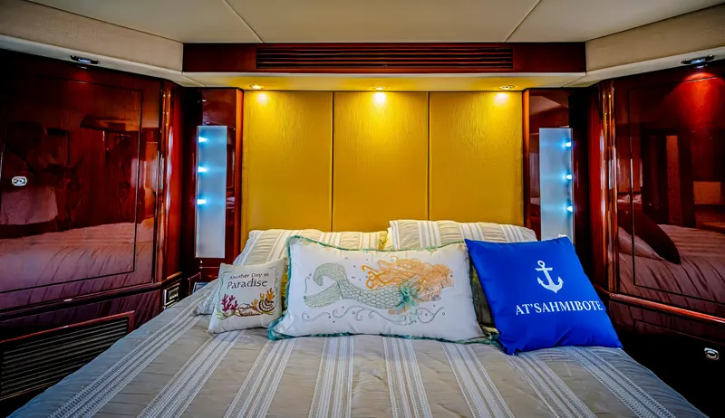 At's Ahmibote V Yacht Photos Pics Luxurious bedroom interior of 2011 Sea Ray 580 Sundancer yacht with decorative pillows.