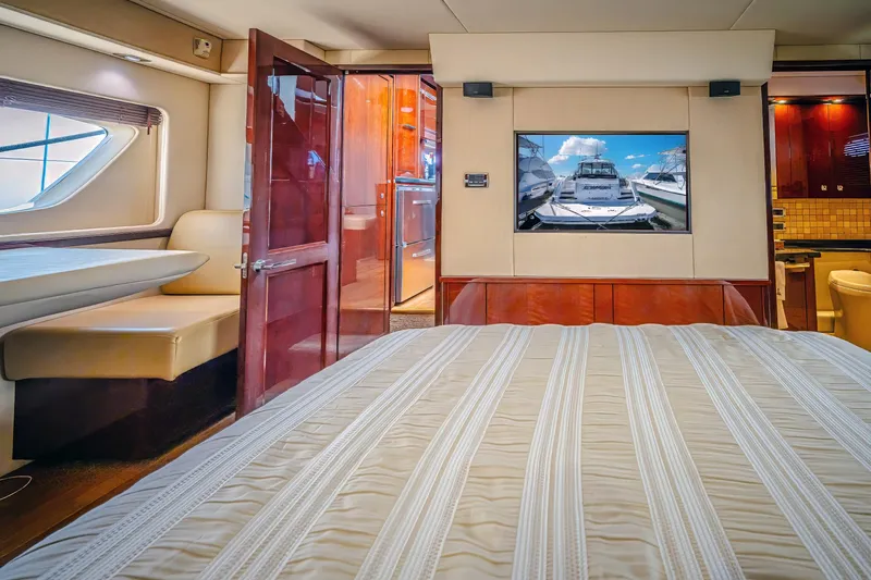 At's Ahmibote V Yacht Photos Pics Luxurious interior of 2011 Sea Ray 580 Sundancer yacht with elegant bedroom design.