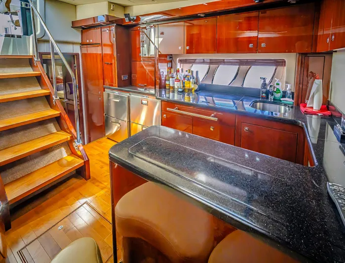 At's Ahmibote V Yacht Photos Pics Luxurious interior of 2011 Sea Ray 580 Sundancer yacht with modern kitchen amenities.