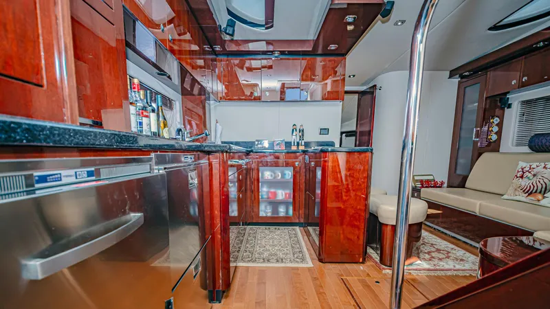 At's Ahmibote V Yacht Photos Pics Luxurious interior of 2011 Sea Ray 580 Sundancer yacht with modern kitchen and seating area.