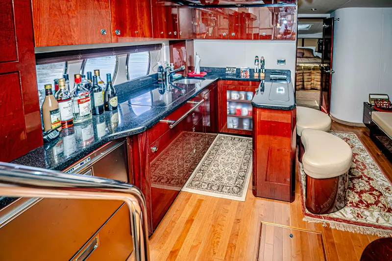 At's Ahmibote V Yacht Photos Pics Luxurious 2011 Sea Ray 580 Sundancer yacht interior with elegant kitchen and bar area.