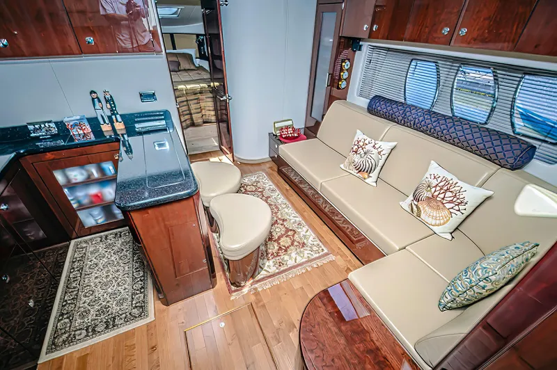 At's Ahmibote V Yacht Photos Pics Luxurious interior of 2011 Sea Ray 580 Sundancer yacht with elegant seating and modern amenities.