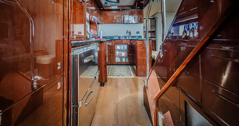 At's Ahmibote V Yacht Photos Pics Luxurious interior of 2011 Sea Ray 580 Sundancer yacht with modern kitchen amenities.