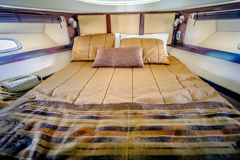 At's Ahmibote V Yacht Photos Pics Luxurious bedroom interior of 2011 Sea Ray 580 Sundancer yacht with cozy bedding.