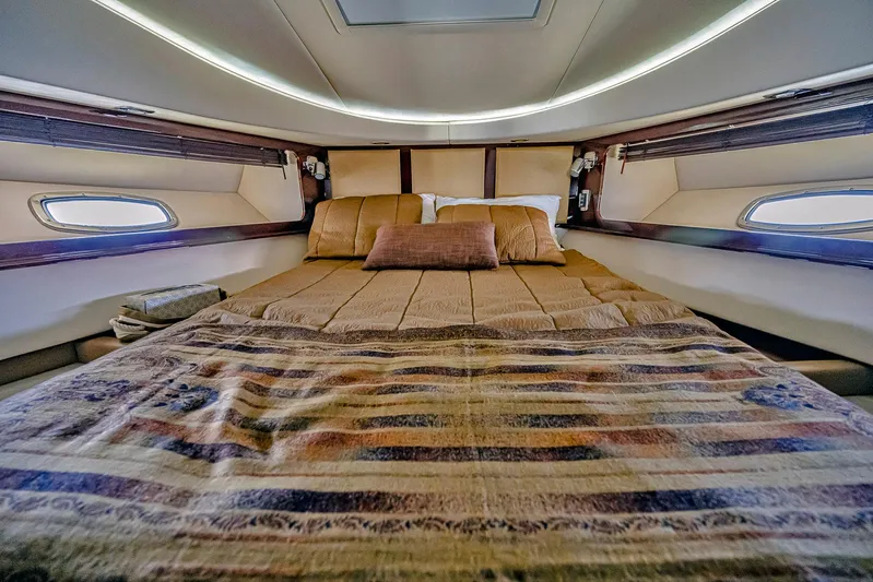 At's Ahmibote V Yacht Photos Pics Luxurious cabin interior of 2011 Sea Ray 580 Sundancer yacht with cozy bedding.