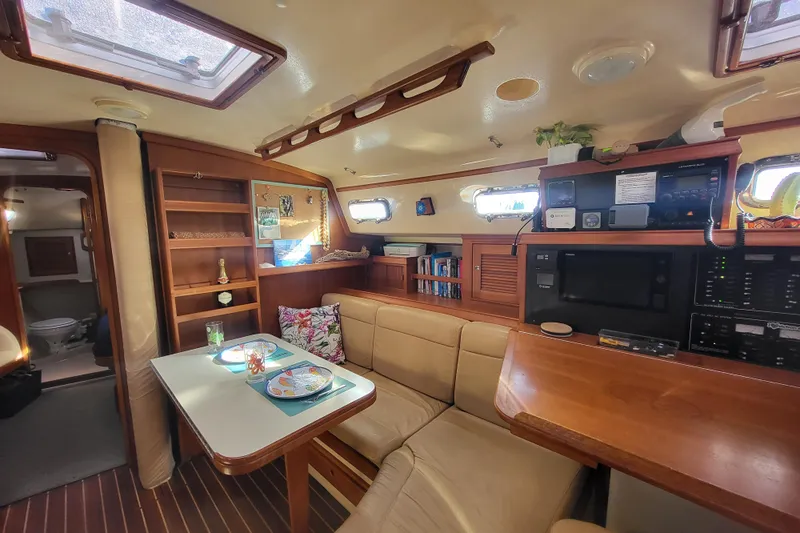 Catharpin Blue Yacht Photos Pics Interior of 1984 Island Packet 420 sailboat with cozy seating and dining area.