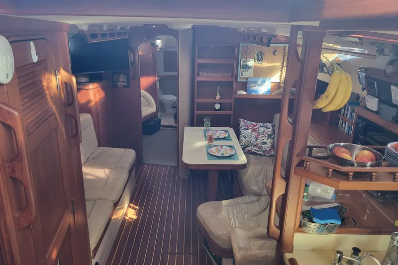 Catharpin Blue Yacht Photos Pics Interior of 1984 Island Packet 420 sailboat with cozy seating and dining area.