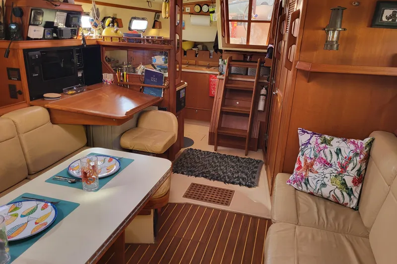Catharpin Blue Yacht Photos Pics Interior of 1984 Island Packet 420 sailboat with cozy seating and dining area.