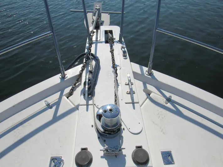 Candy O Yacht Photos Pics Bow of 1999 Sabreline 47 yacht with anchor chain and winch.