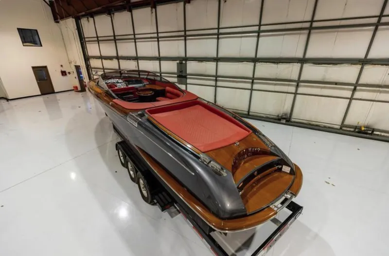  Yacht Photos Pics 2013 Riva Aquariva 33 luxury boat in a spacious indoor storage facility.