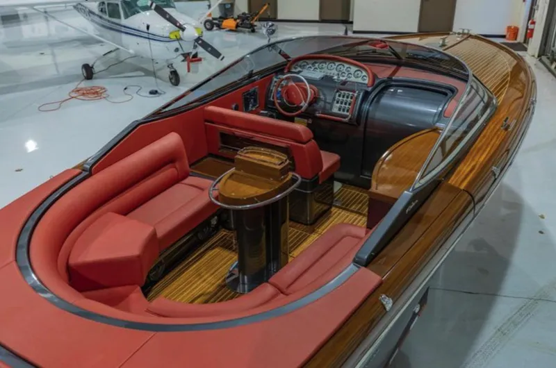  Yacht Photos Pics Luxurious 2013 Riva Aquariva 33 boat with elegant red seating and polished wood interior.