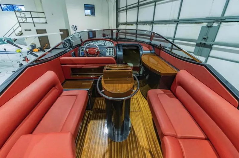  Yacht Photos Pics Interior of 2013 Riva Aquariva 33 with red seating and polished wood flooring.