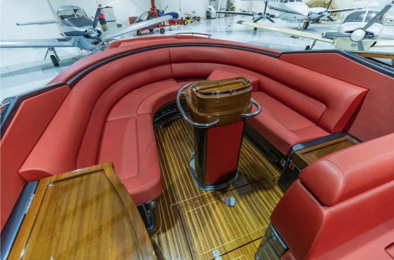  Yacht Photos Pics Luxurious 2013 Riva Aquariva 33 interior with red leather seating and wooden flooring.