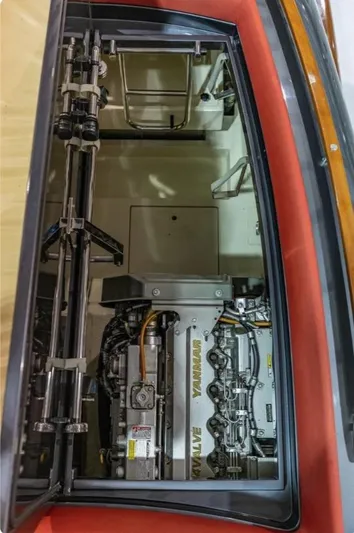  Yacht Photos Pics Engine compartment of a 2013 Riva Aquariva 33 boat, showcasing detailed machinery.