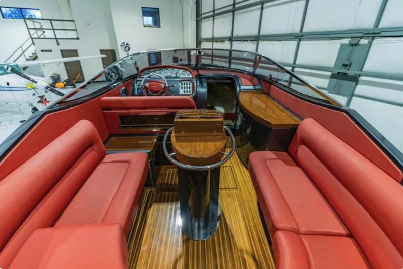  Yacht Photos Pics Luxurious 2013 Riva Aquariva 33 interior with red seating and polished wood accents.