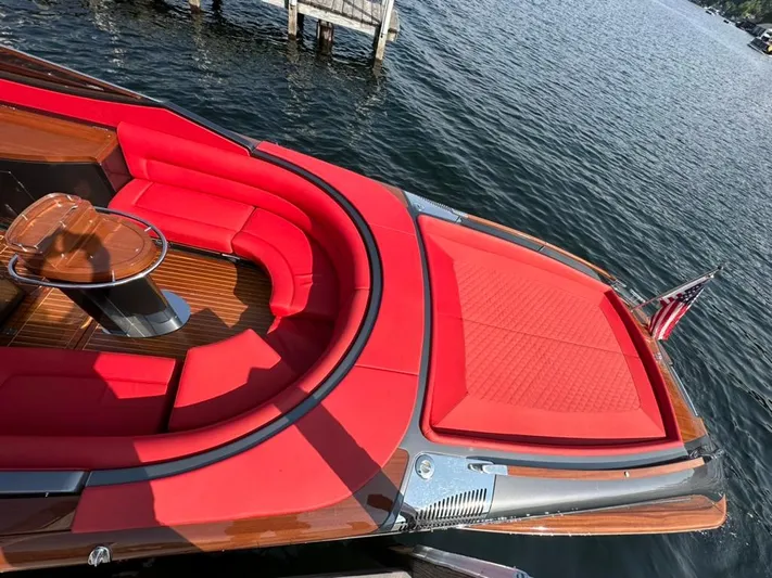  Yacht Photos Pics Luxurious 2013 Riva Aquariva 33 boat with vibrant red seating and elegant wood finish.
