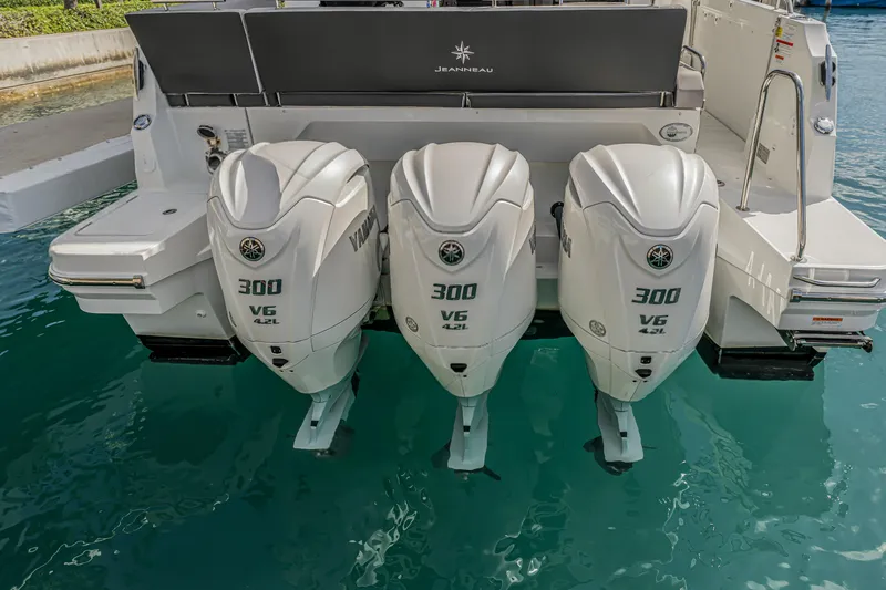 Rhapsody In Sea Yacht Photos Pics 2025 Jeanneau NC 1295 Fly with triple Yamaha 300 V6 outboard engines.