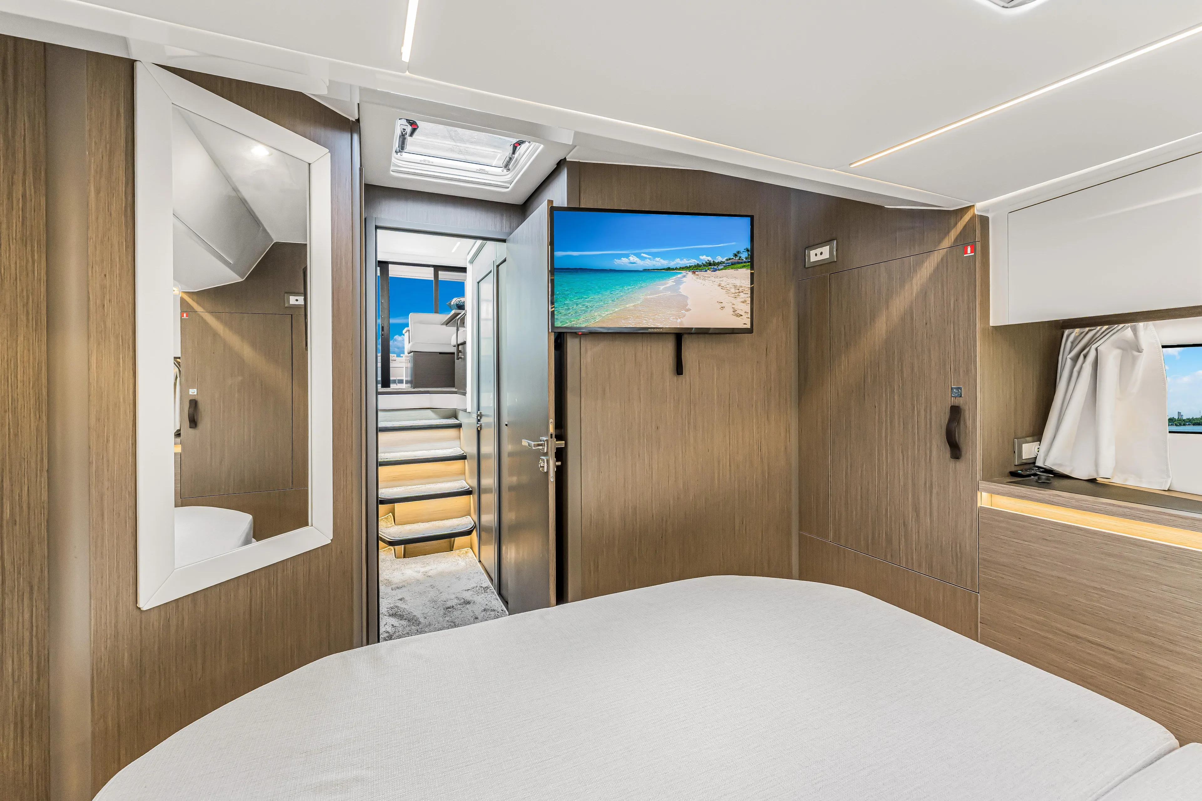 Rhapsody In Sea Yacht Photos Pics Luxurious interior of 2025 Jeanneau NC 1295 Fly yacht with modern amenities and elegant design.