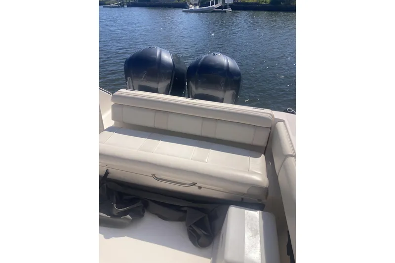  Yacht Photos Pics 2014 Pursuit ST 310 Sport boat with dual engines and cushioned seating.