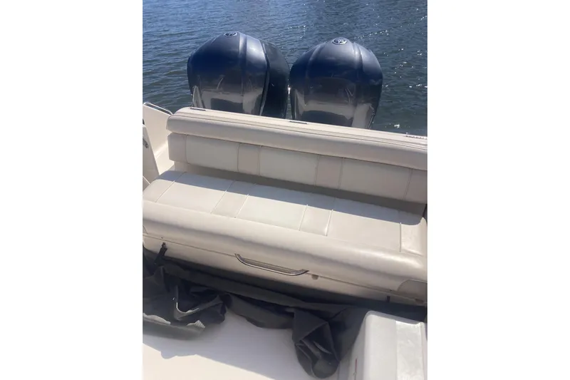  Yacht Photos Pics 2014 Pursuit ST 310 Sport boat with dual engines and cushioned seating.