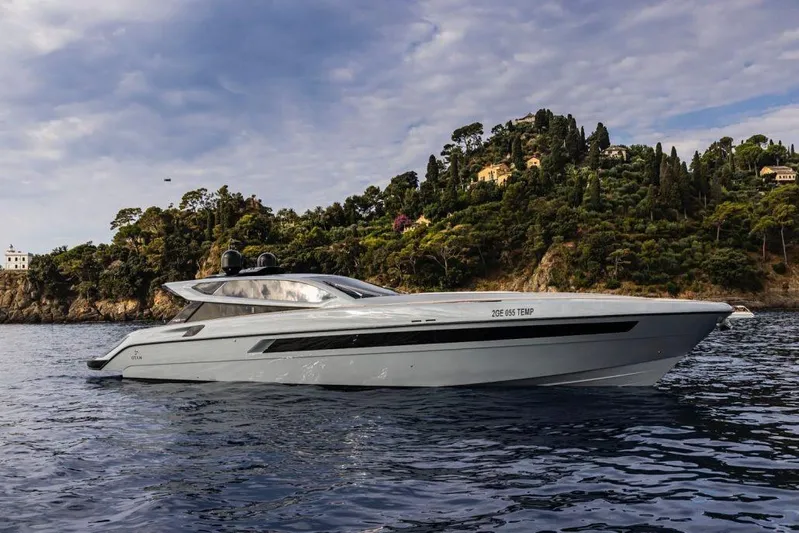  Yacht Photos Pics 2021 Otam 70 yacht cruising near scenic coastline with lush greenery.