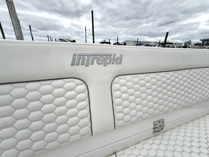 Panacea Yacht Photos Pics 2019 Intrepid 475 Panacea boat seat with hexagonal pattern and logo.