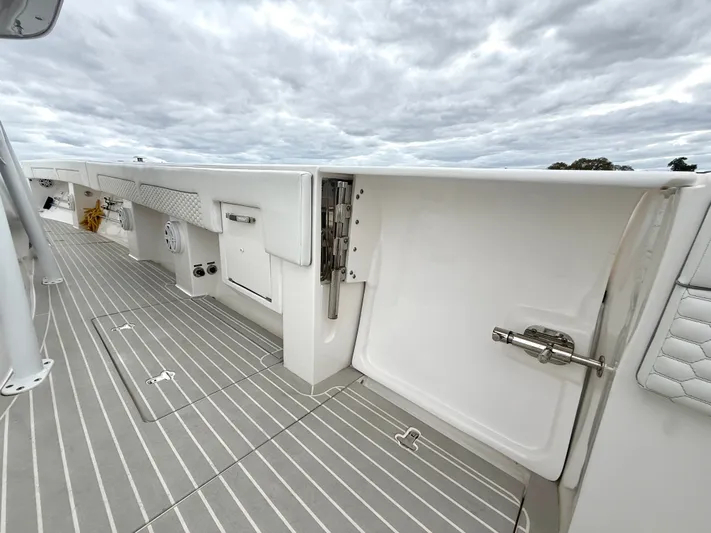 Panacea Yacht Photos Pics 2019 Intrepid 475 Panacea boat deck with storage compartments and sleek design.