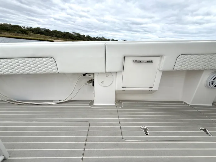 Panacea Yacht Photos Pics 2019 Intrepid 475 Panacea boat deck with storage compartment and sleek design.