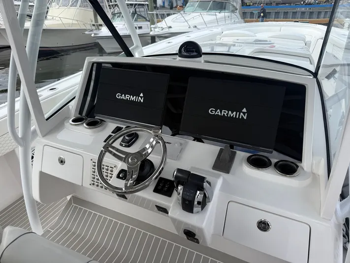 Panacea Yacht Photos Pics 2019 Intrepid 475 Panacea helm with Garmin displays and modern controls.