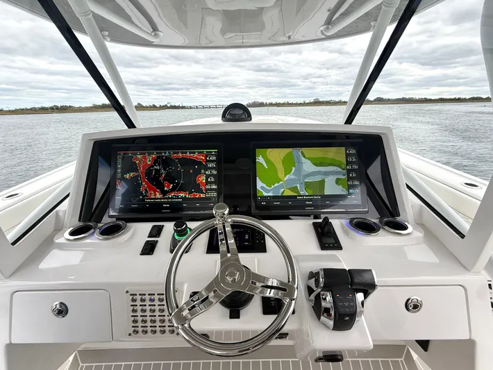 Panacea Yacht Photos Pics 2019 Intrepid 475 Panacea helm with dual navigation screens and sleek steering wheel.
