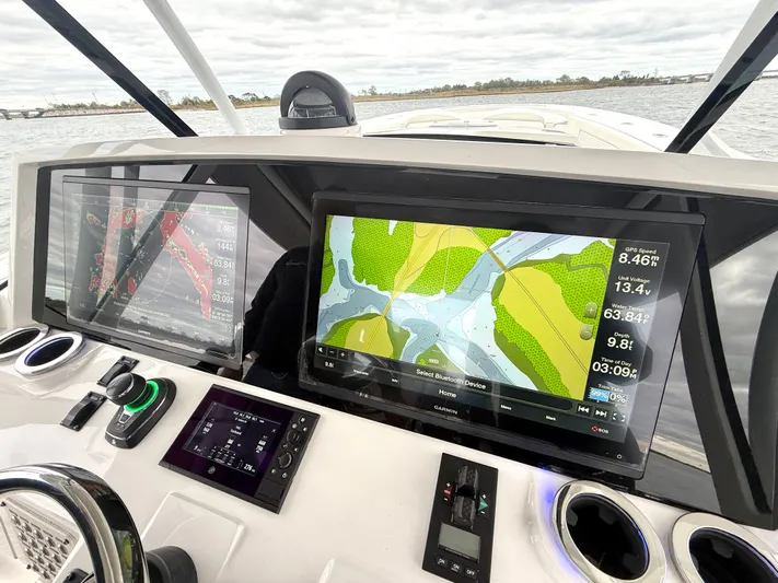 Panacea Yacht Photos Pics 2019 Intrepid 475 Panacea dashboard with navigation screens and controls.