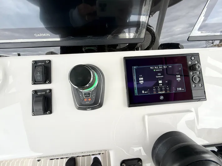 Panacea Yacht Photos Pics Control panel of a 2019 Intrepid 475 Panacea with Garmin display and navigation controls.