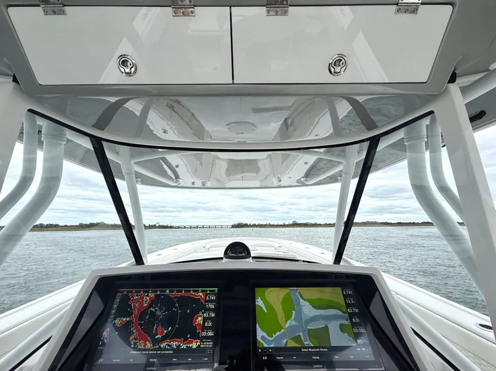 Panacea Yacht Photos Pics 2019 Intrepid 475 Panacea helm with dual navigation screens, open water view.