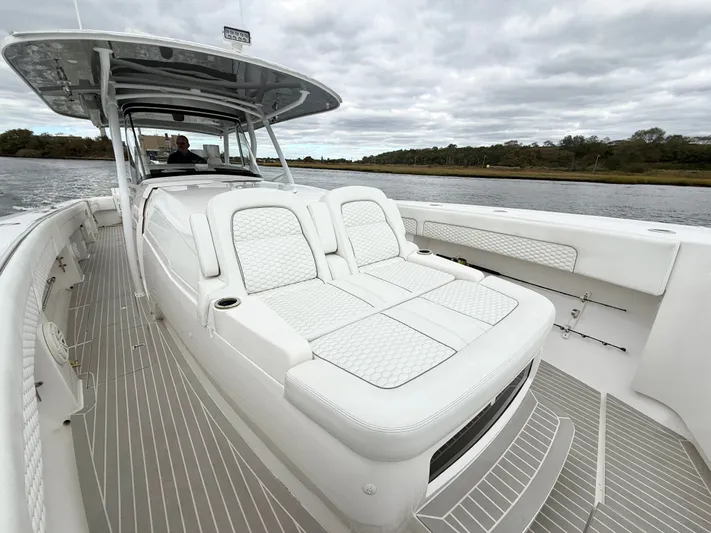 Panacea Yacht Photos Pics 2019 Intrepid 475 Panacea boat with luxurious seating on a calm waterway.
