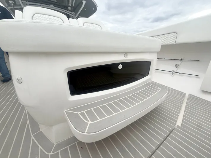 Panacea Yacht Photos Pics 2019 Intrepid 475 Panacea boat deck with seating and storage compartment.
