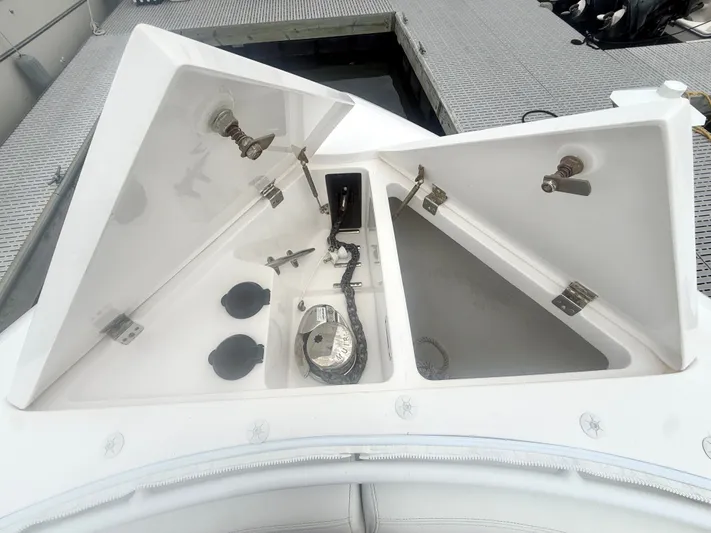 Panacea Yacht Photos Pics Open storage compartments on a 2019 Intrepid 475 Panacea boat at a dock.