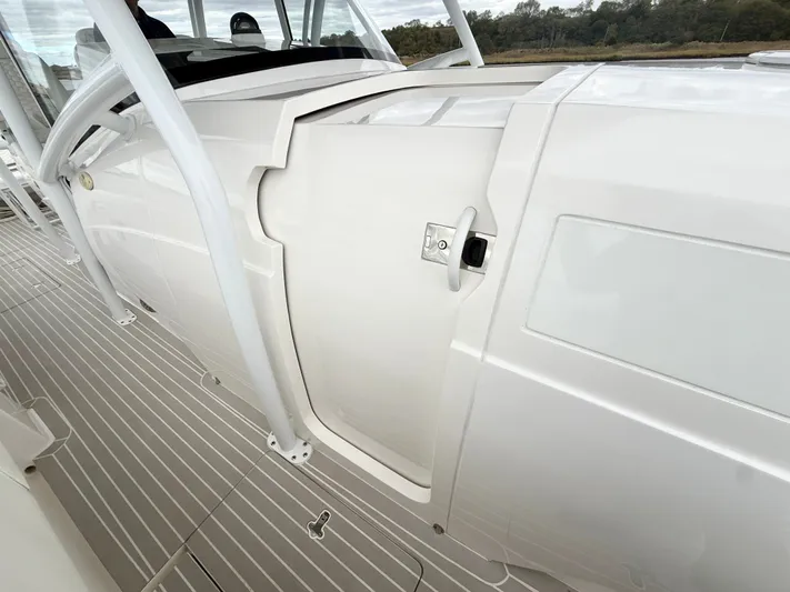 Panacea Yacht Photos Pics 2019 Intrepid 475 Panacea boat interior with sleek white design and modern features.