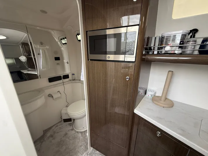 Panacea Yacht Photos Pics 2019 Intrepid 475 Panacea interior with modern bathroom and kitchenette amenities.