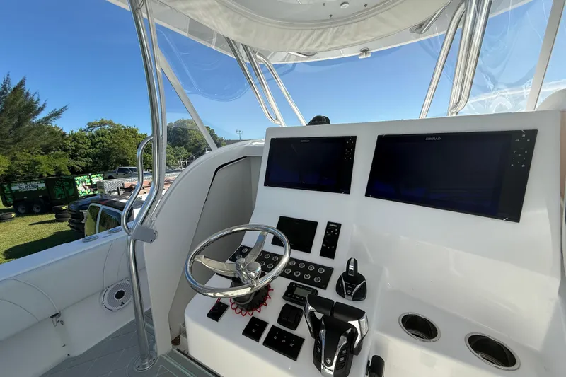  Yacht Photos Pics 2023 Contender 39 Fisharound boat helm with dual screens and controls.