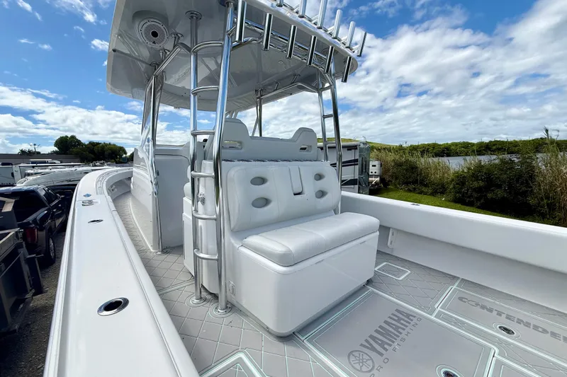  Yacht Photos Pics 2023 Contender 39 Fisharound boat with sleek design and comfortable seating.