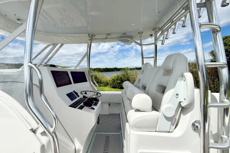  Yacht Photos Pics 2023 Contender 39 Fisharound boat interior with sleek helm and comfortable seating.