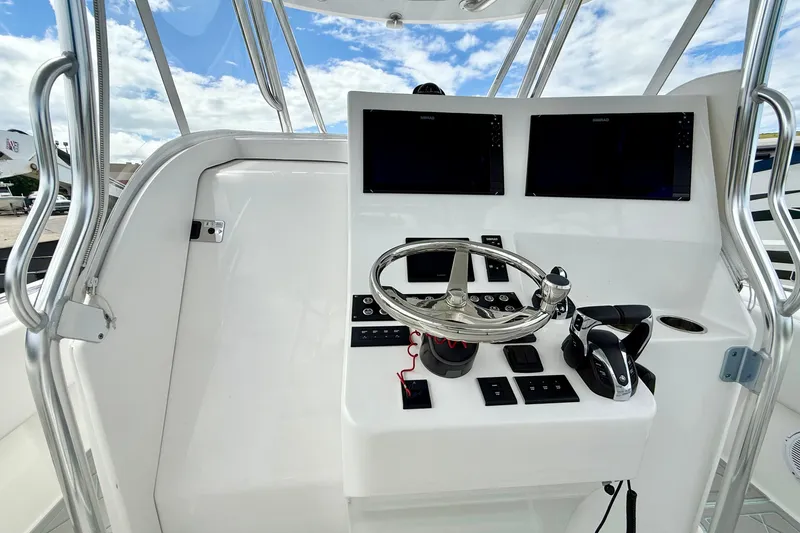 Yacht Photos Pics 2023 Contender 39 Fisharound helm with dual displays and modern controls.