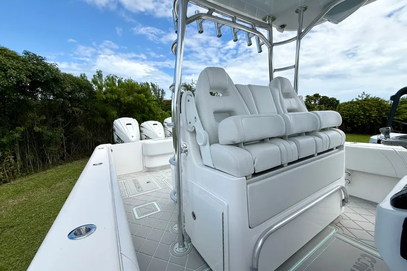  Yacht Photos Pics 2023 Contender 39 Fisharound boat with white seating and triple outboard engines.