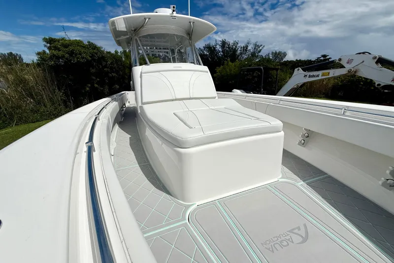  Yacht Photos Pics 2023 Contender 39 Fisharound boat with sleek white seating and modern design.