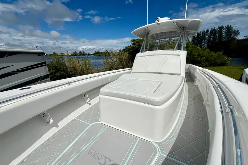  Yacht Photos Pics 2023 Contender 39 Fisharound boat with sleek design, spacious deck, and comfortable seating.