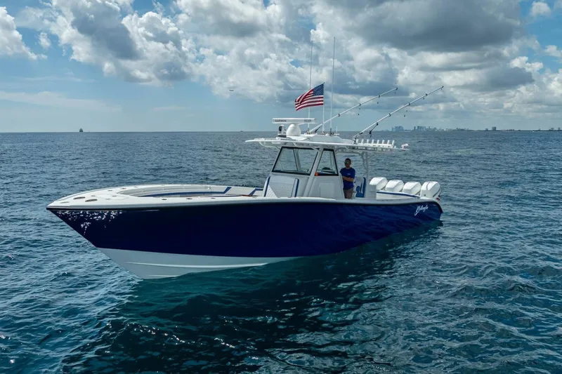  Yacht Photos Pics 2023 Yellowfin 39 Offshore boat on open sea under cloudy sky.