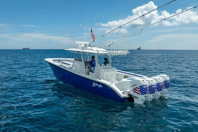  Yacht Photos Pics 2023 Yellowfin 39 Offshore boat with multiple outboard engines on open sea.