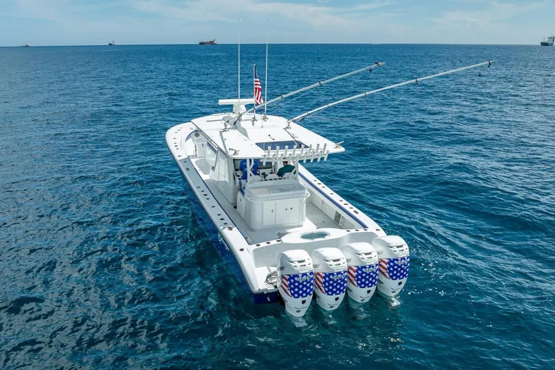  Yacht Photos Pics 2023 Yellowfin 39 Offshore boat with four engines on open ocean.